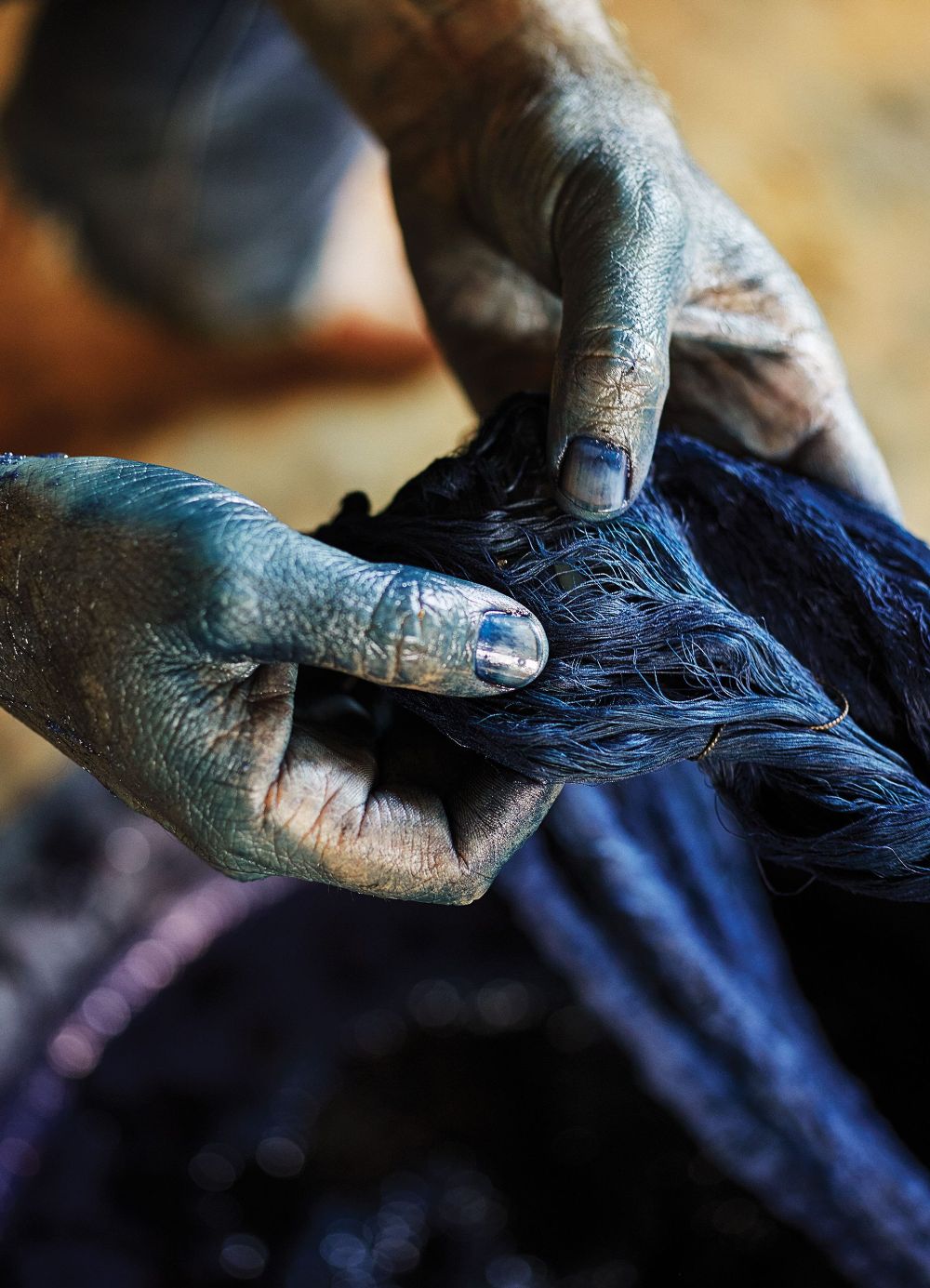 A hand holding indigo dye of kokikar 