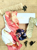 Colorful fabric with leave patterns on a textured surface