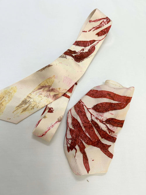 Two marbled silk tie designs on a white background