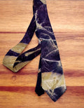Pure silk mens tie on a wooden surface