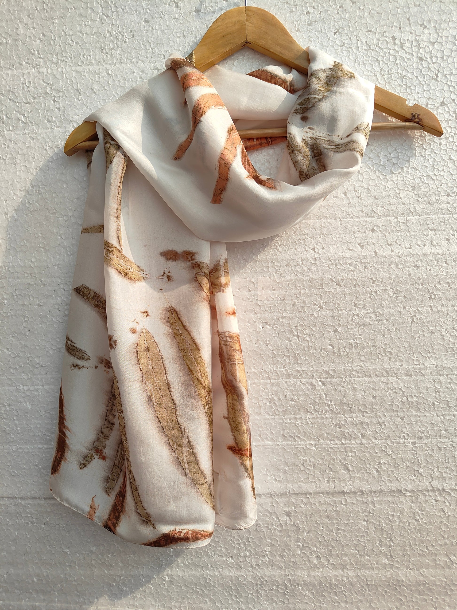 A white ecoprinted scarf