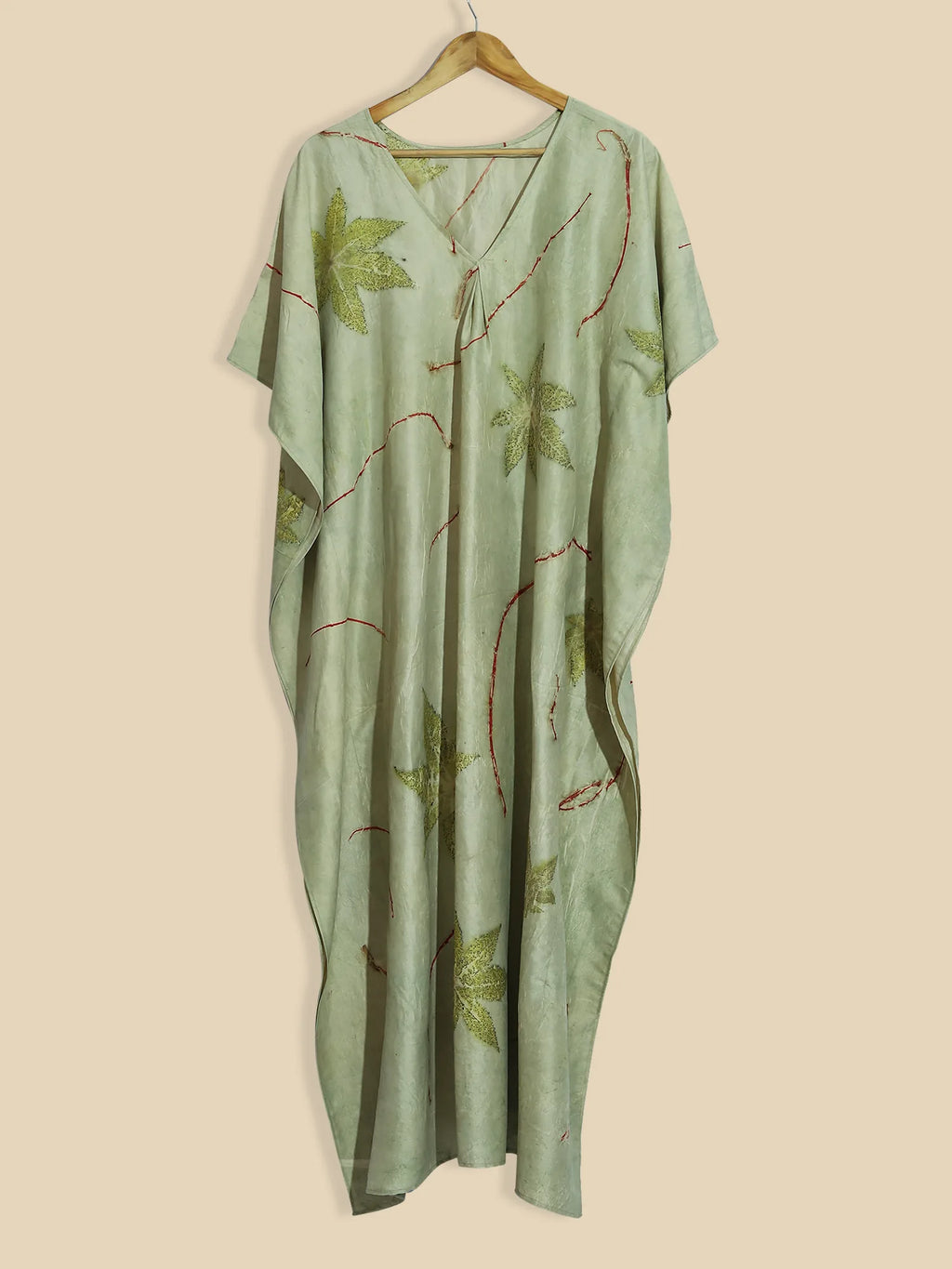 Green Charm ecoprinted kaftan on kokikar wall
