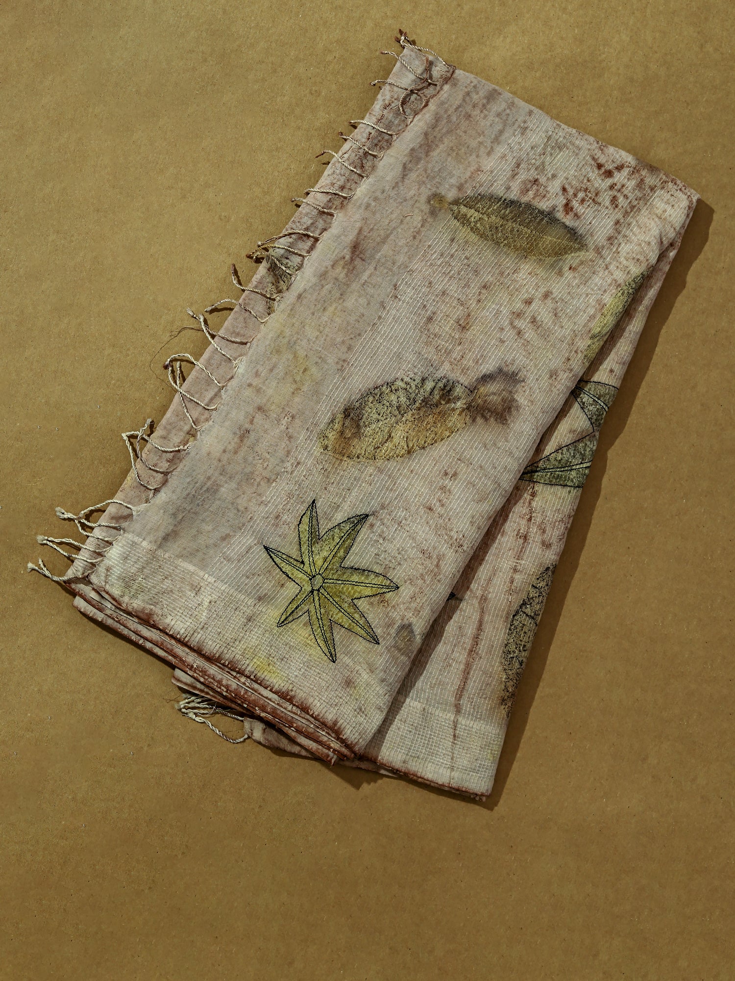 An EcoPrinted folded Cotton Saree
