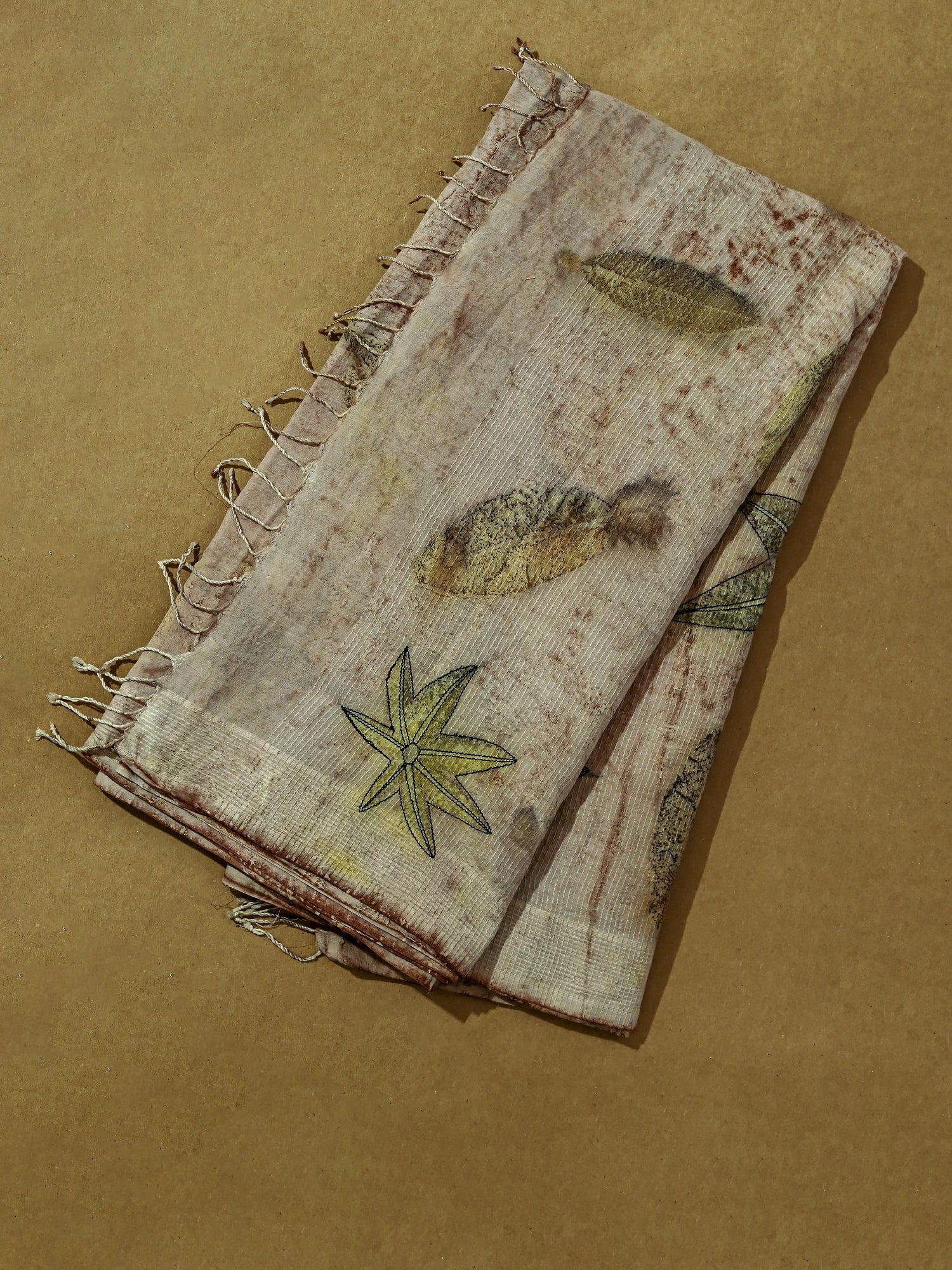 Castor Tapestry Ecoprinted Mulmul Cotton Saree by kokikar on floor