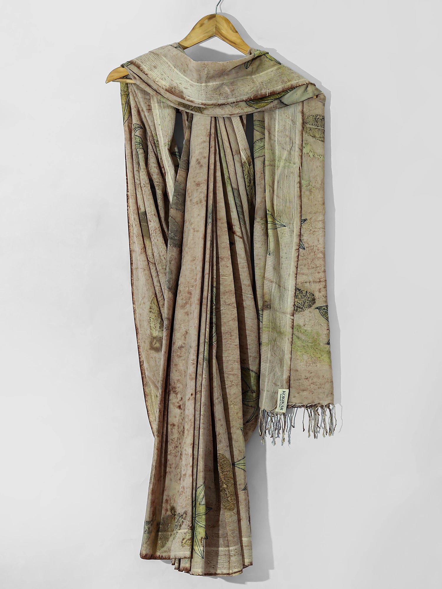 Castor Tapestry Ecoprinted Mulmul Cotton Saree by kokikar drapped on hanger