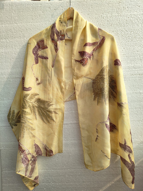 An ecoprinted yellow scarf