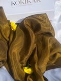 An ecoprinted green scarf