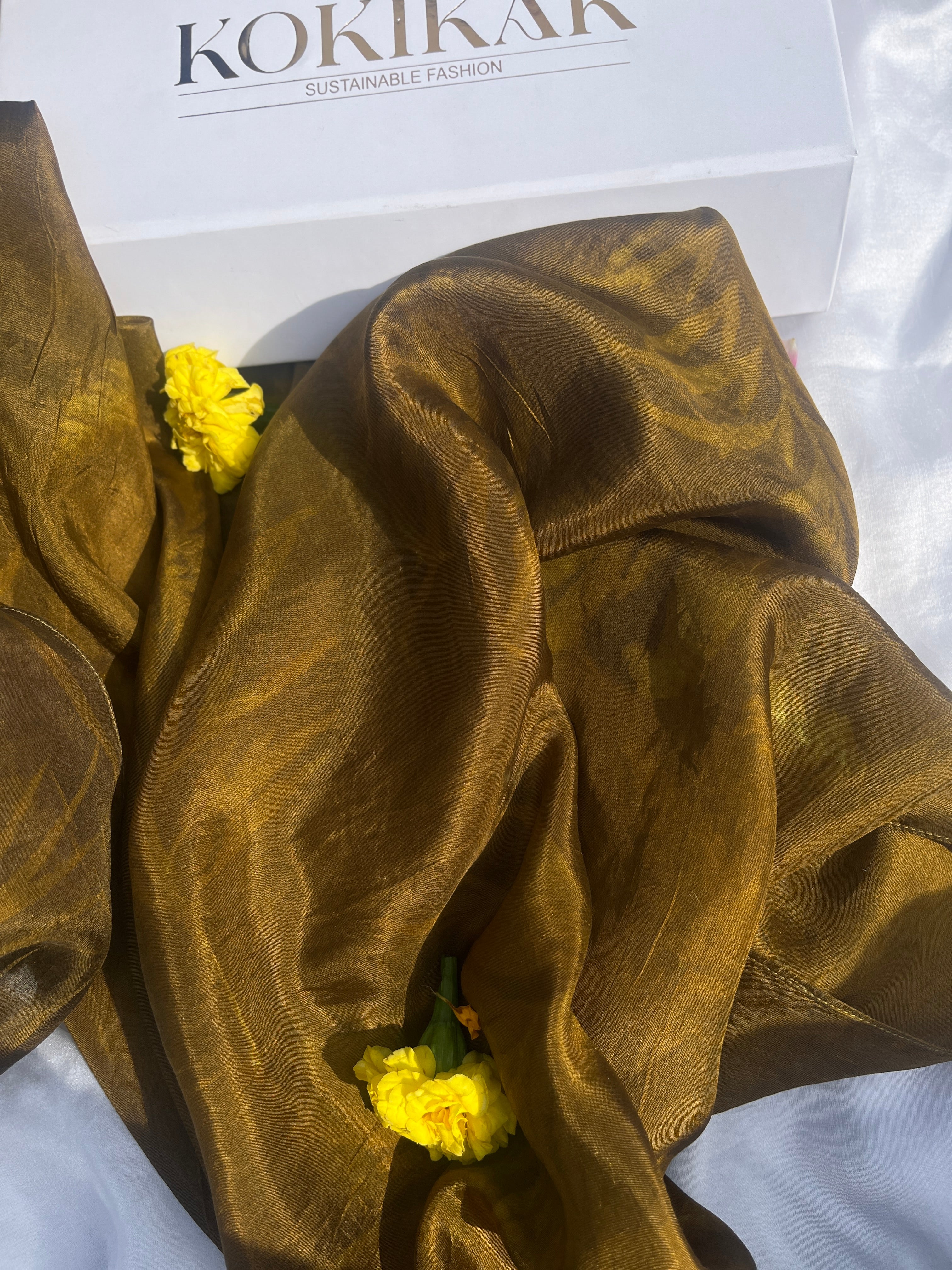 An ecoprinted green scarf
