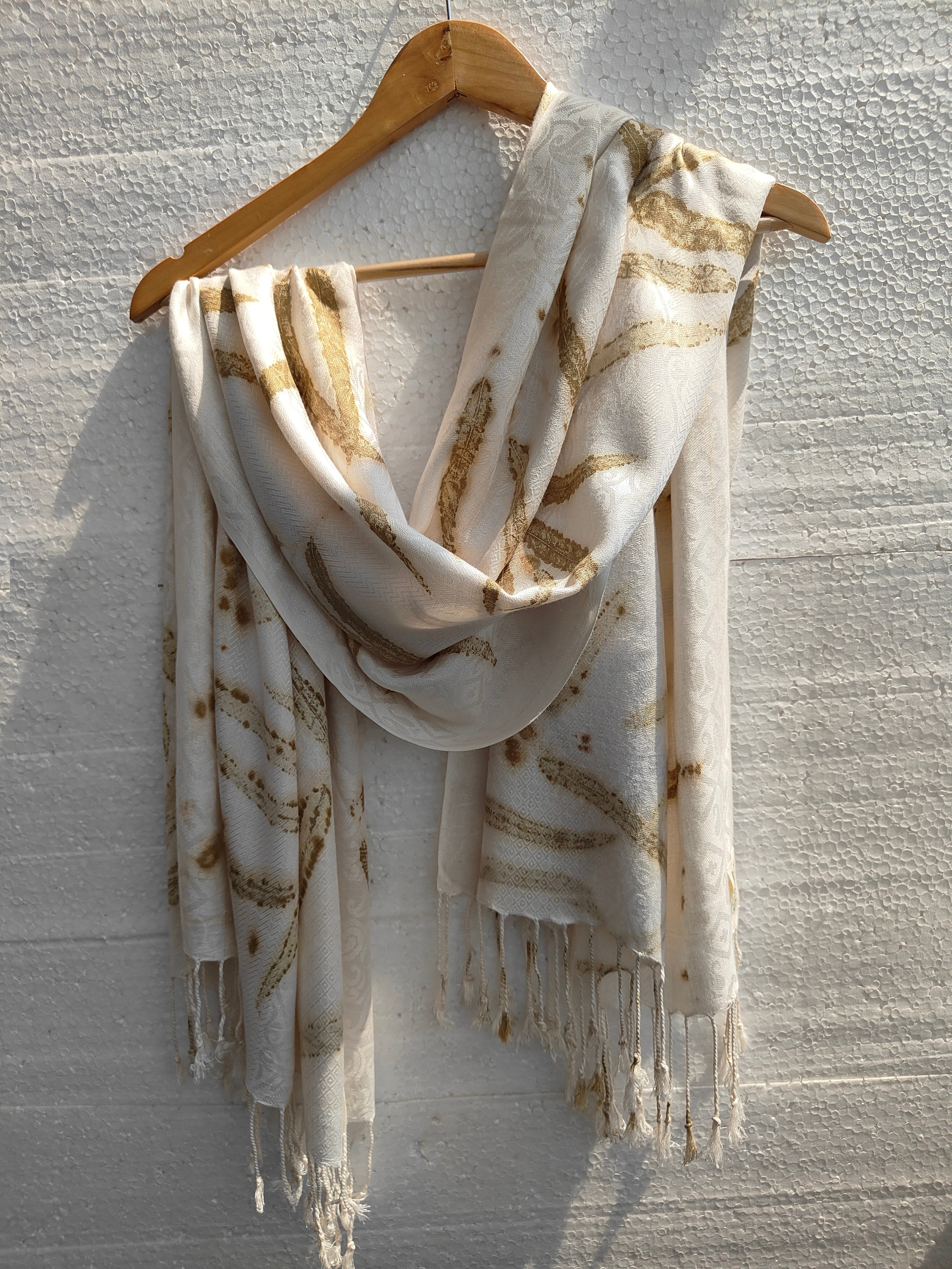 An ecoprinted viscose scarf