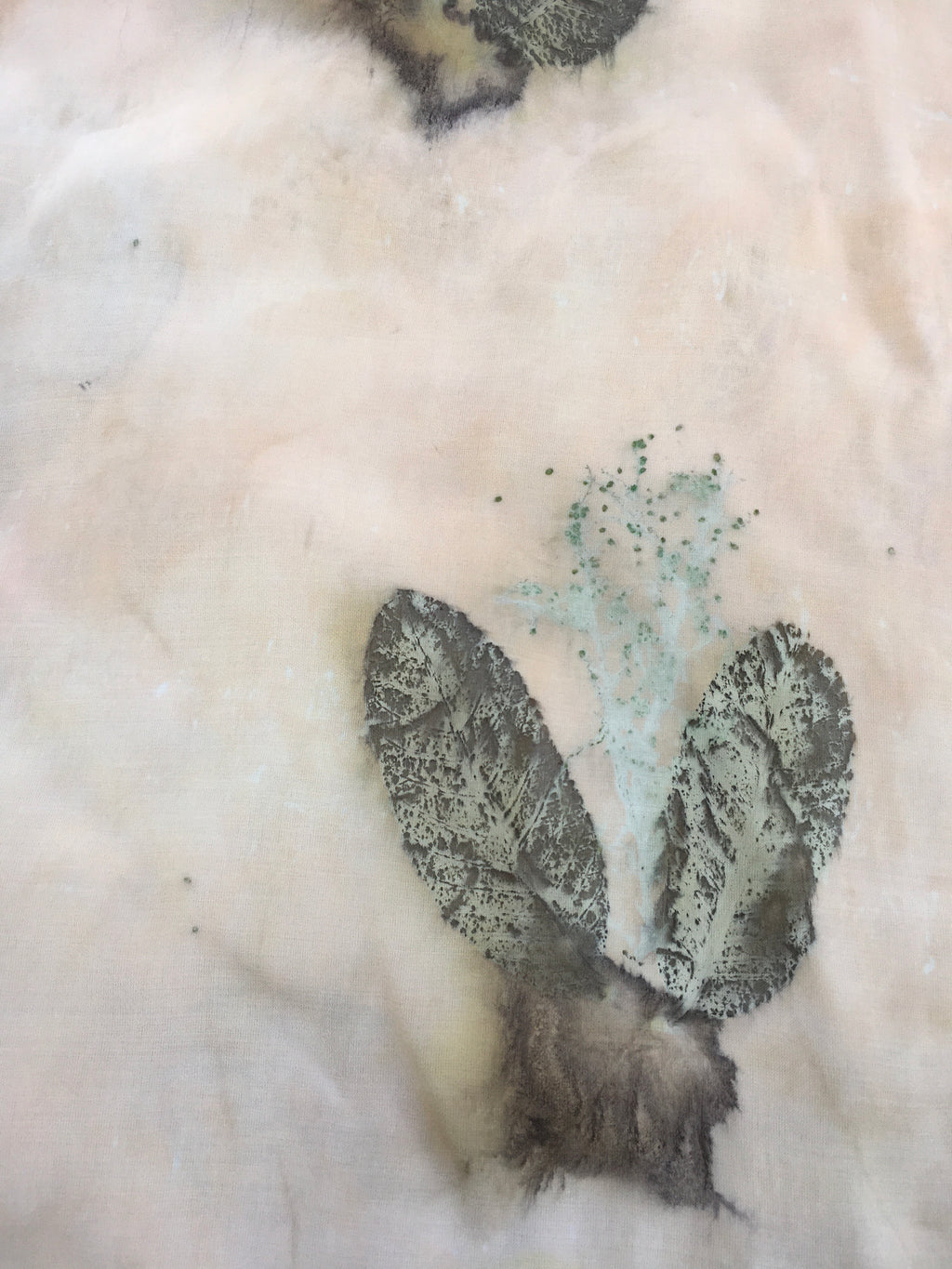 Feathers on a textured Kaftan Flared Top surface