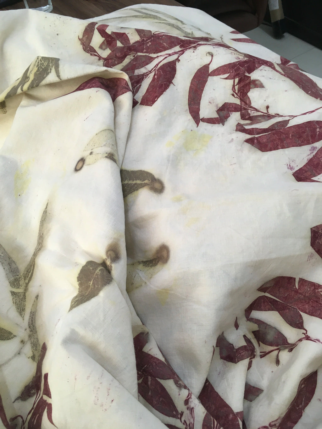 A fabric with ecoprinted eucalyptus print