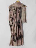 Saree with a floral pattern draped over a hanger on a white background