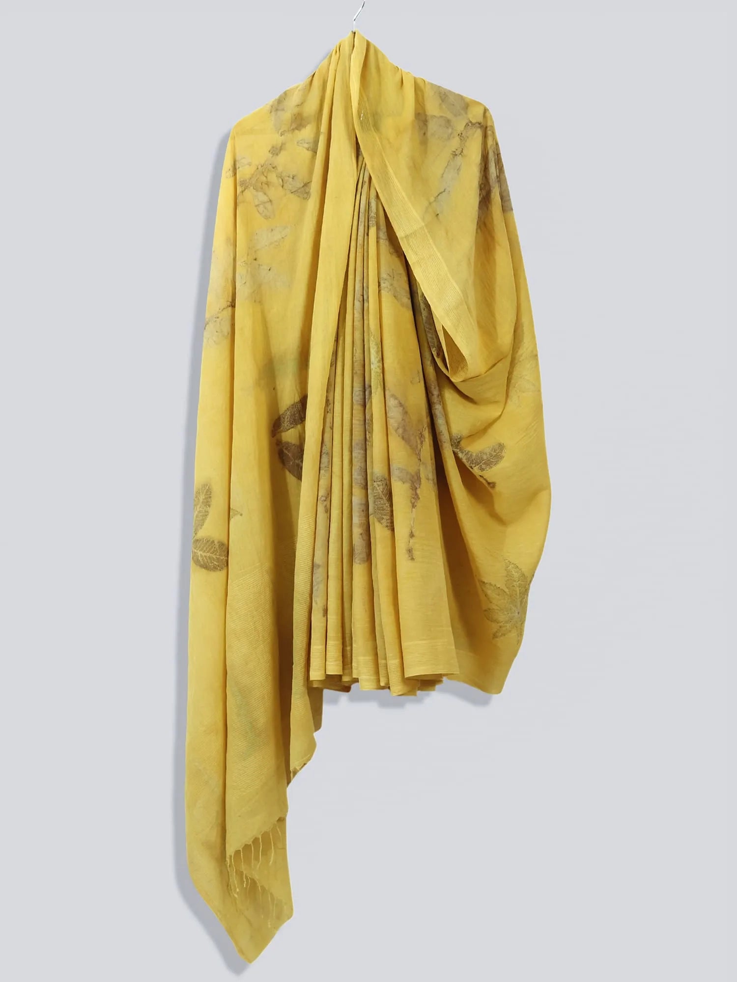 Yellow Ginkgo Grace Mulmul Cotton Saree drapped on hanger