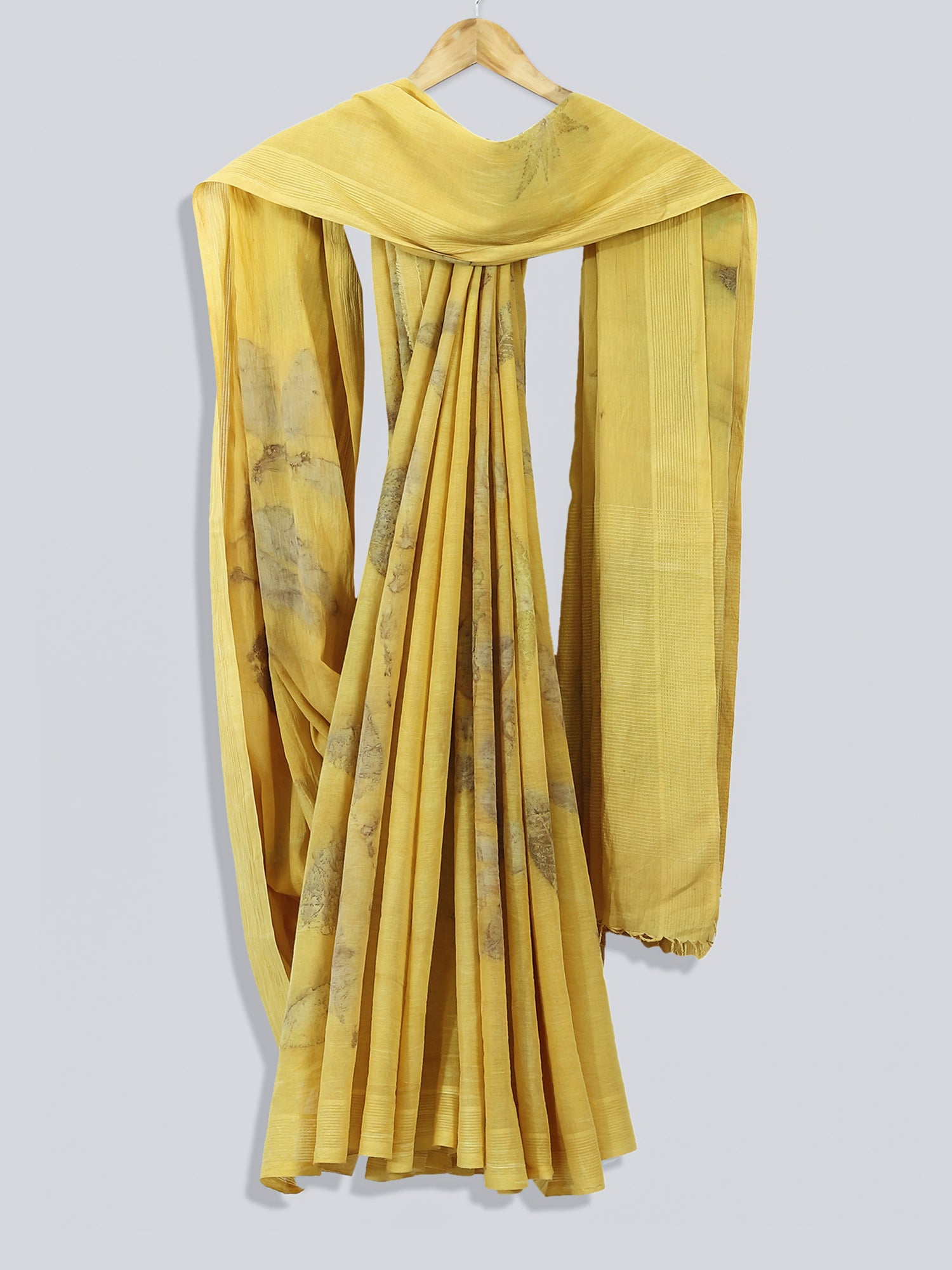 A draped yellow saree