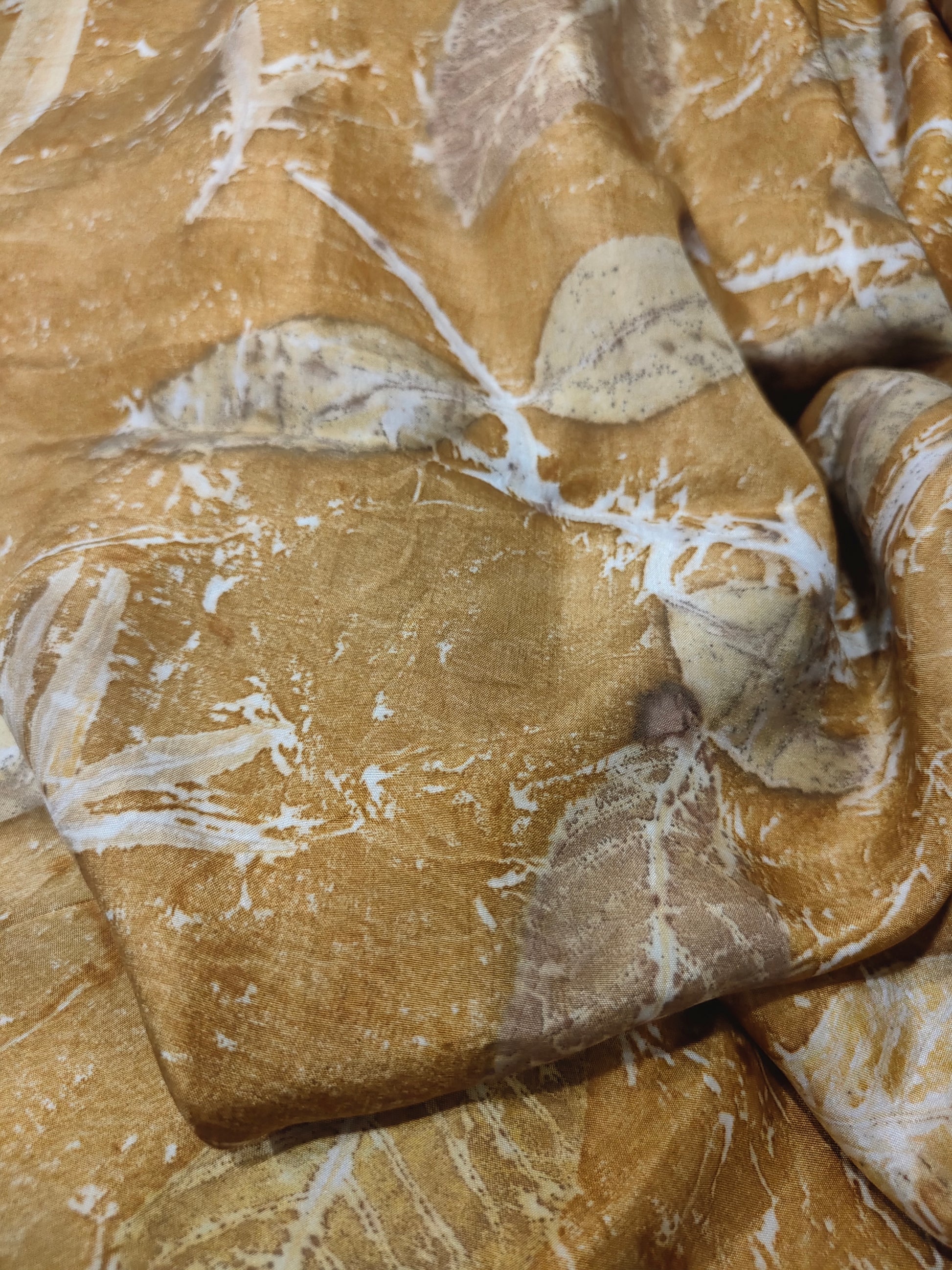 Brown ecoprinted silk fabric with ecoprinted leaves