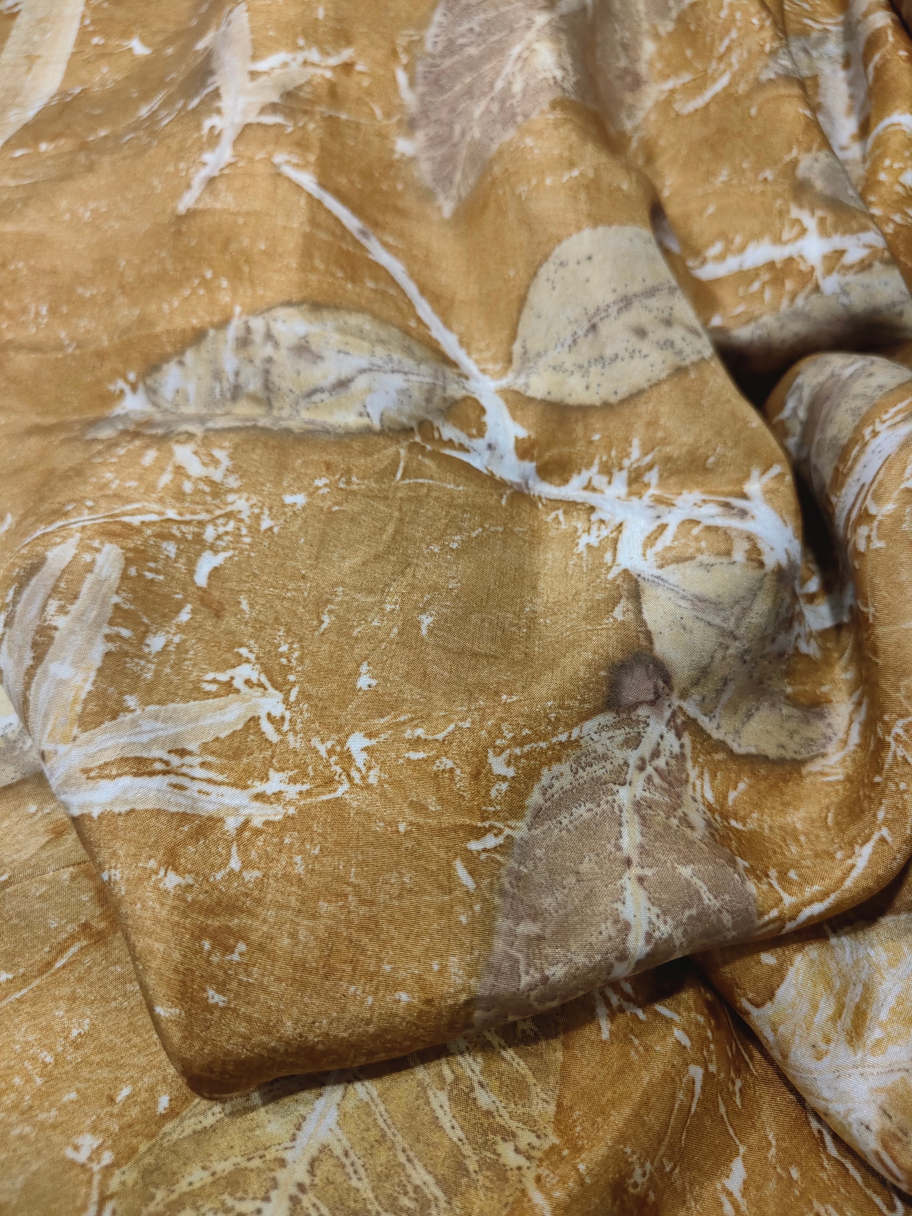 Brown ecoprinted silk fabric with ecoprinted leaves