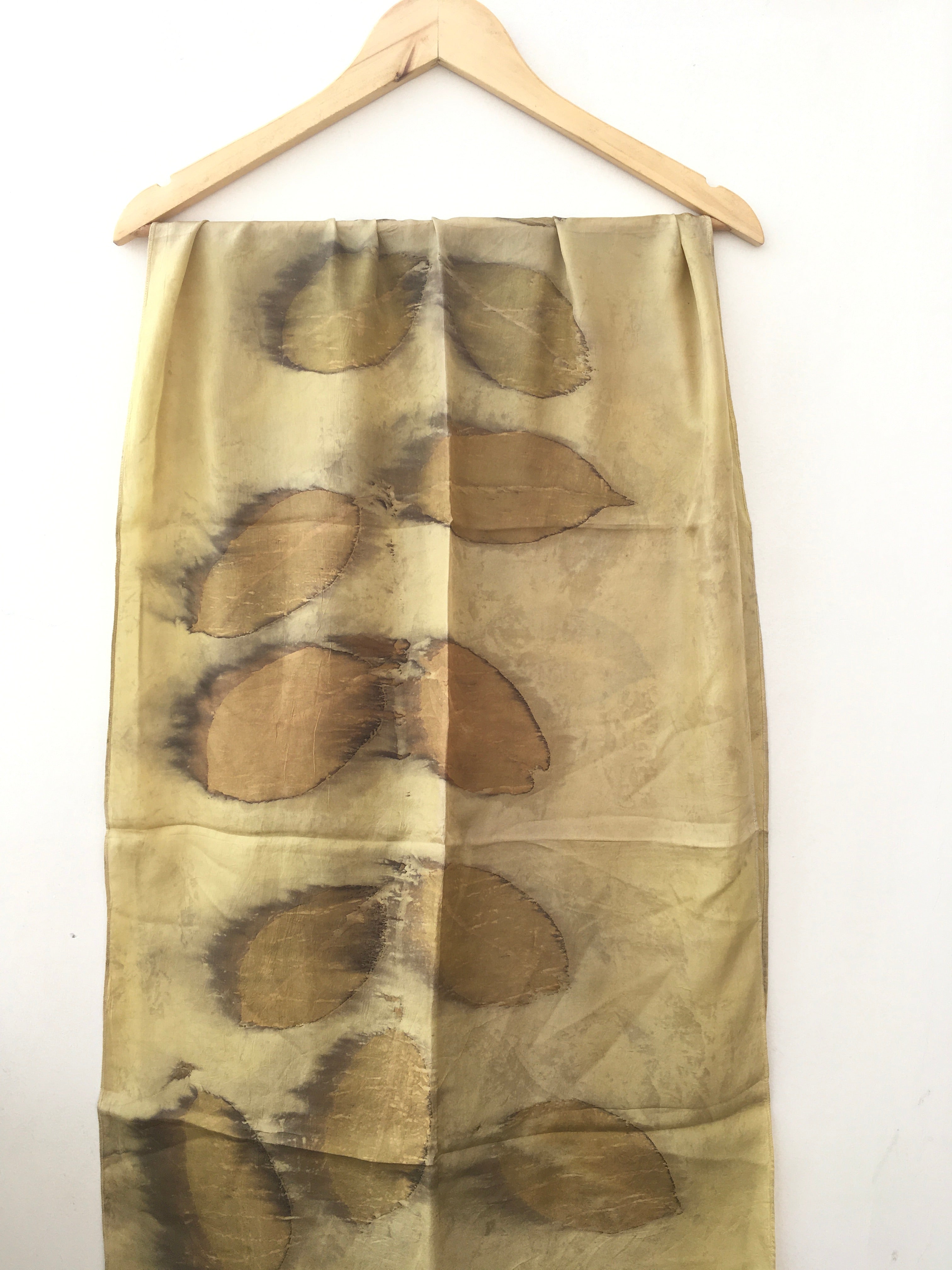 pure silk scarf with brown leaf pattern on a white background