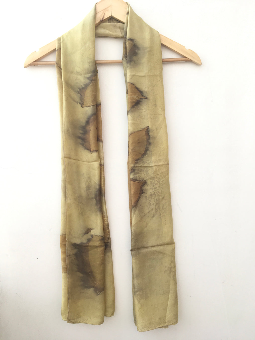 pure silk scarf with a leaves pattern on a white background