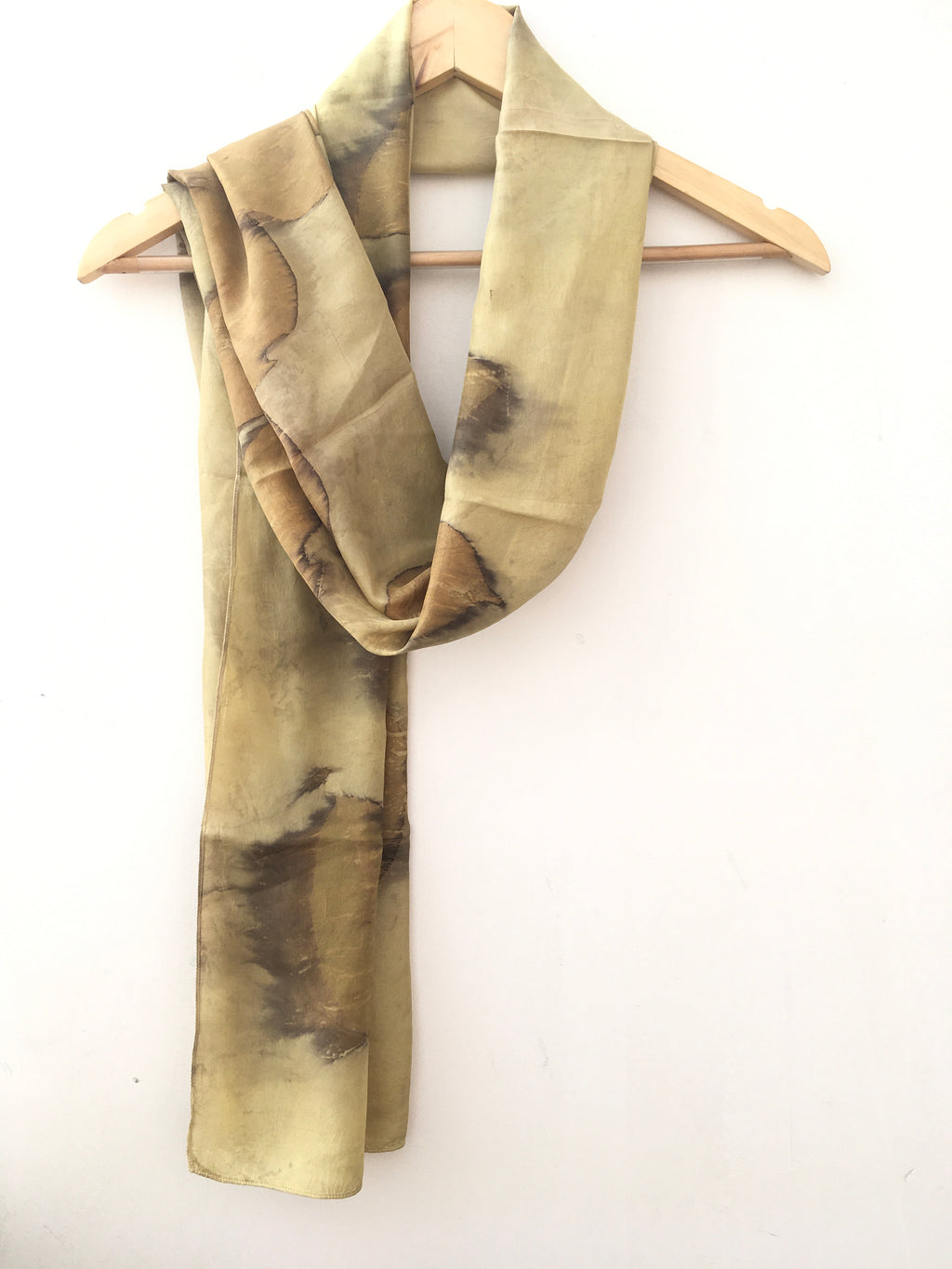 pure silk scarf with leaves pattern on a white background