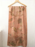 pure silk ecoprinted scarf with leaf pattern on a white background