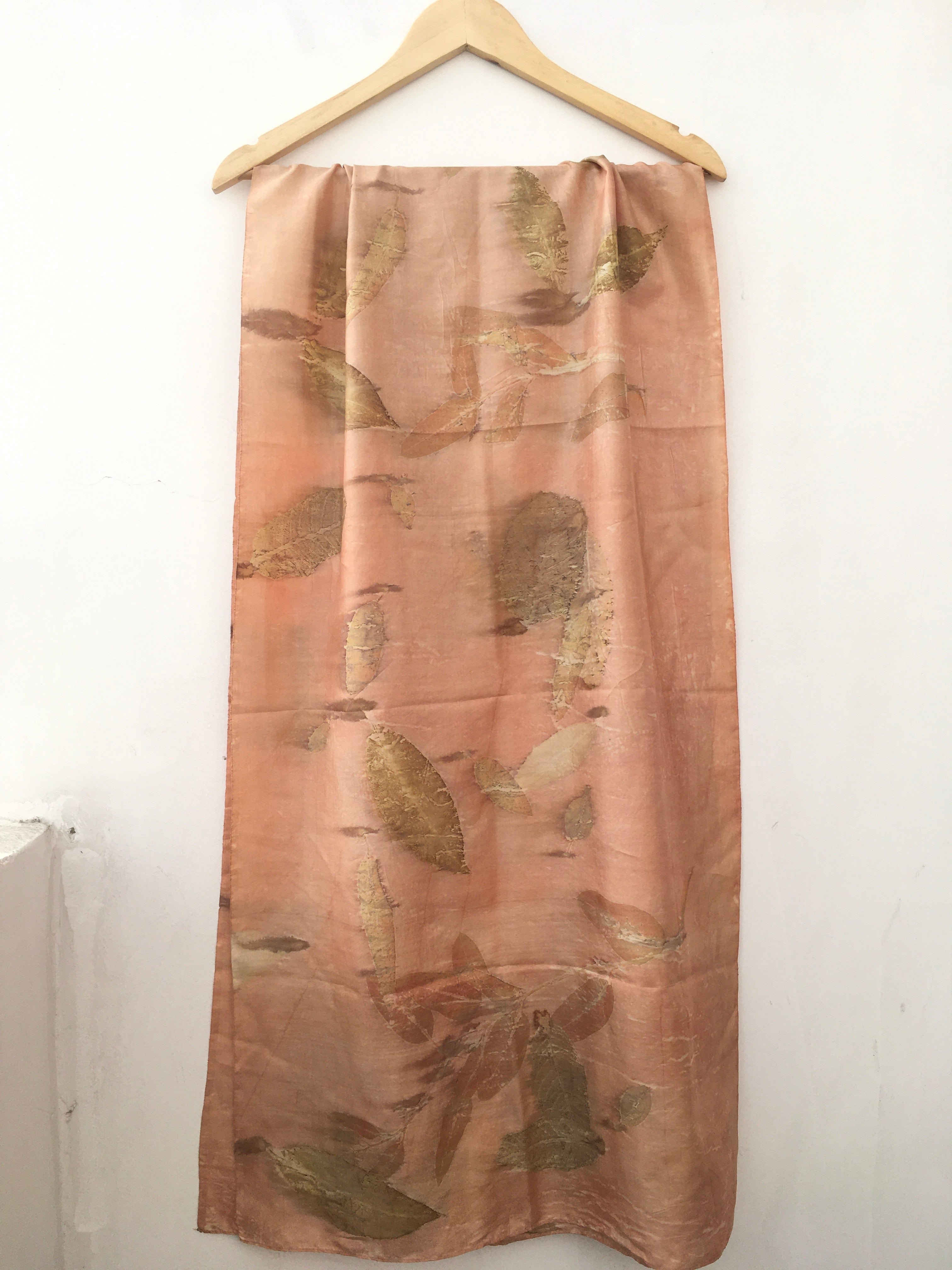 pure silk ecoprinted scarf with leaf pattern on a white background