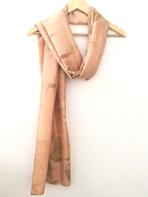pure silk ecoprinted scarf with leaves on a white background