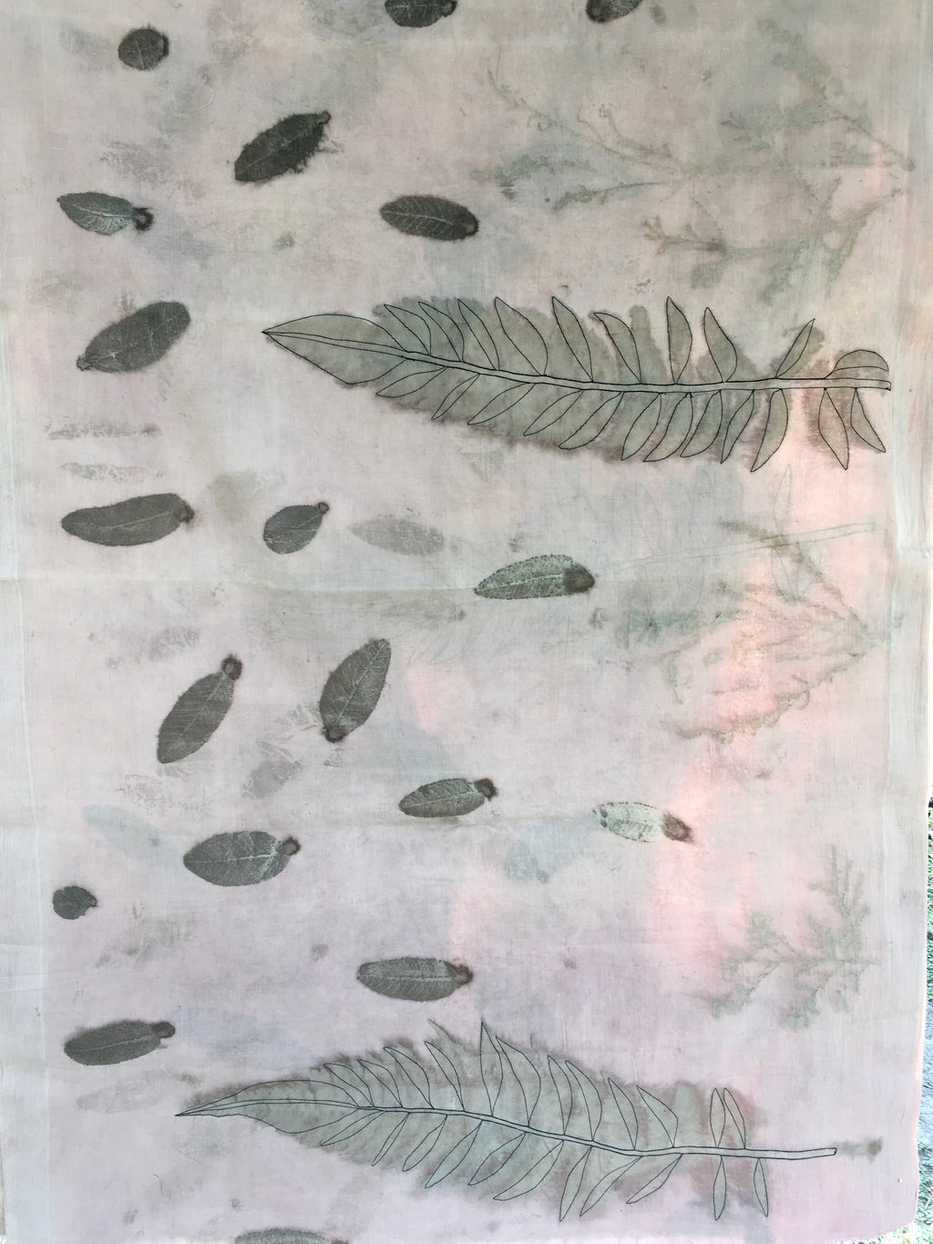 Pattern of leaves and abstract shapes on a ecoprinted cotton saree