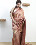 Woman wearing a pure matka silk saree with a white background