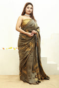 Woman wearing a Jamun Ecoprinted pure matka silk saree with a neutral background