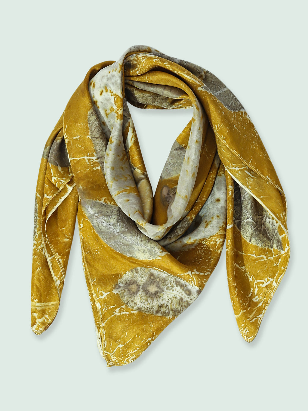 A folded silk square scarf