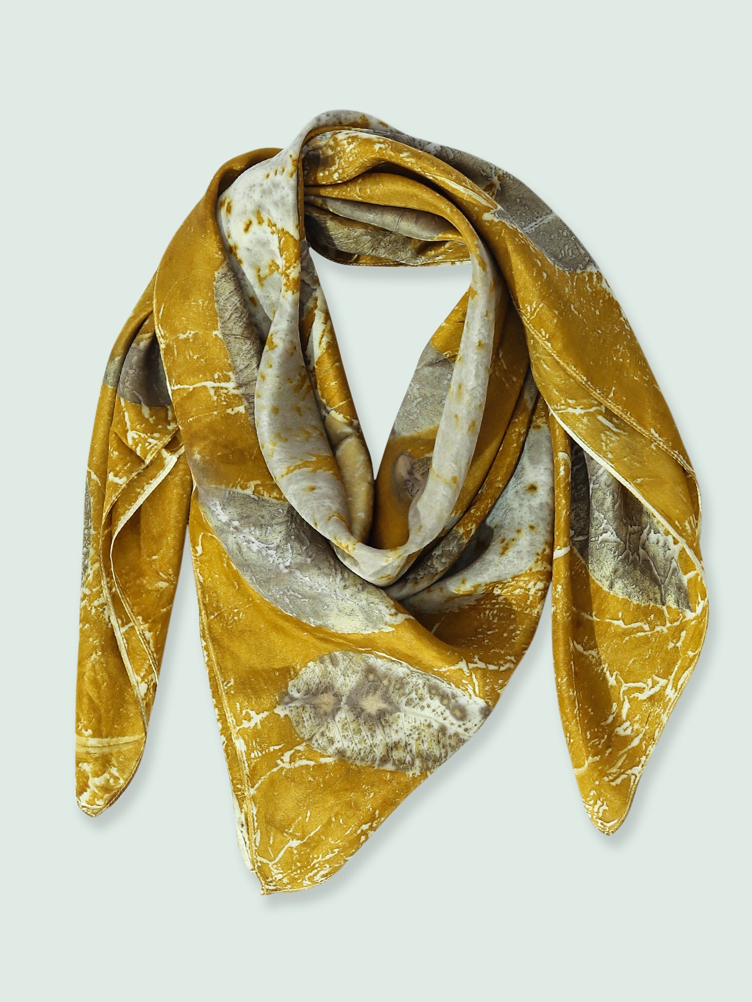 A folded silk square scarf
