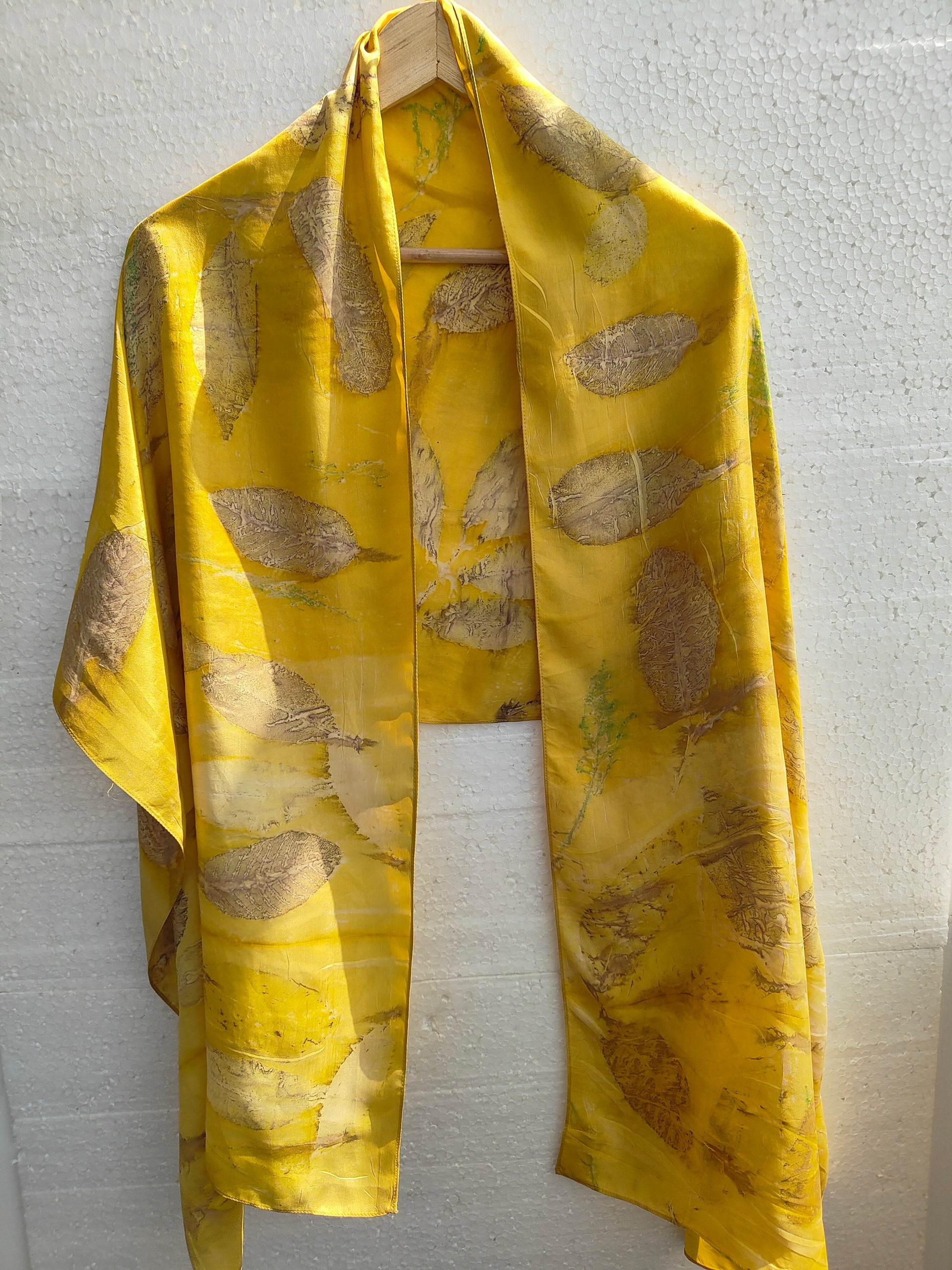 An ecoprinted silk scarf