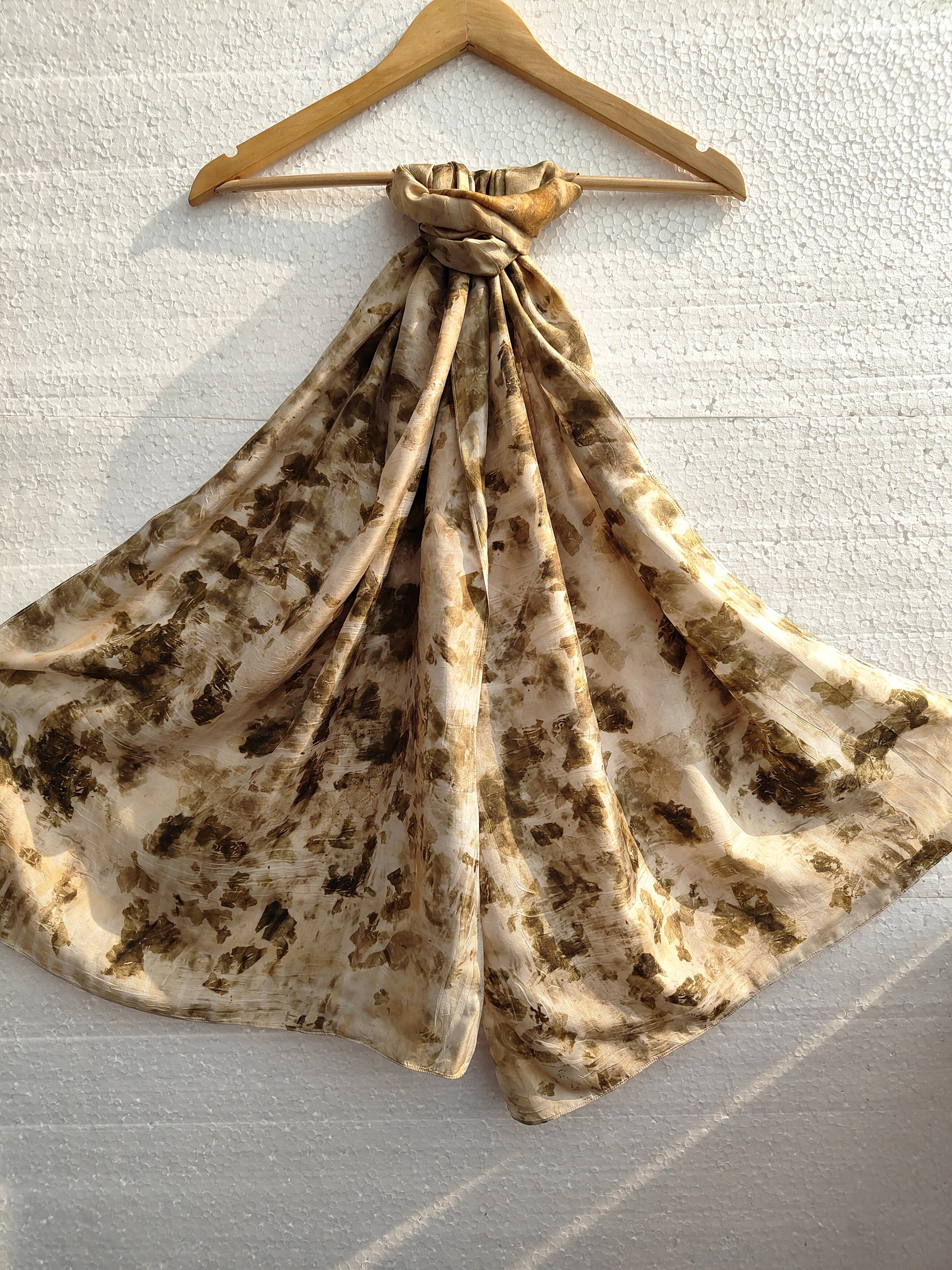 A hanging ecoprinted scarf