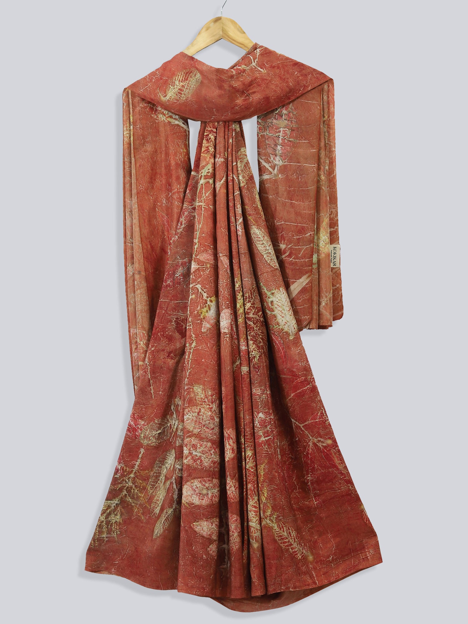 A draped maroon saree