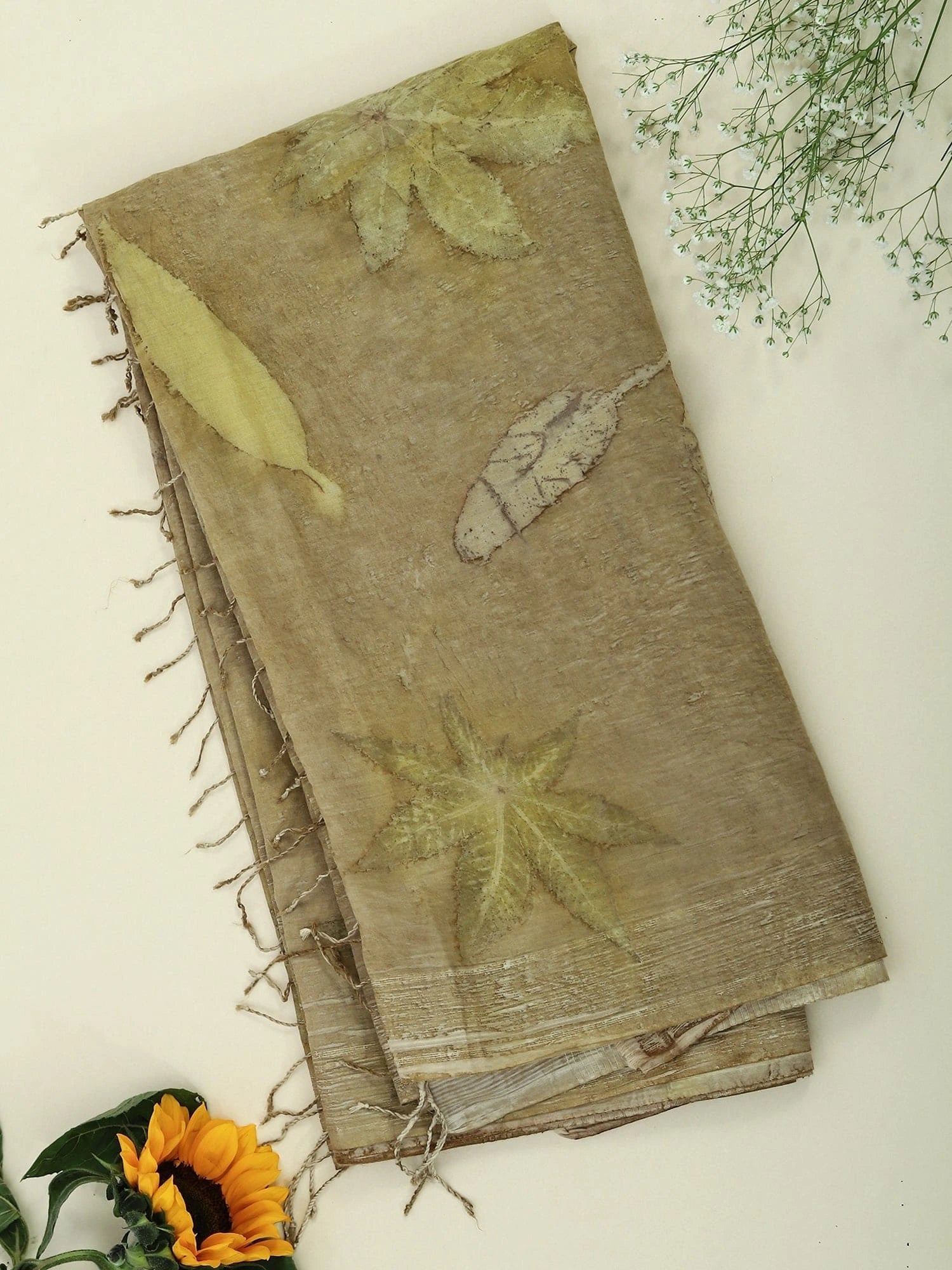 Naturally Dyed Mulmul Ecoprinted Saree by kokikar on the floor