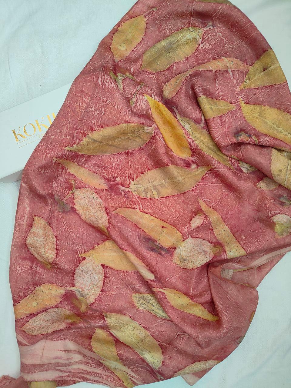 An ecoprinted pink scarf with box