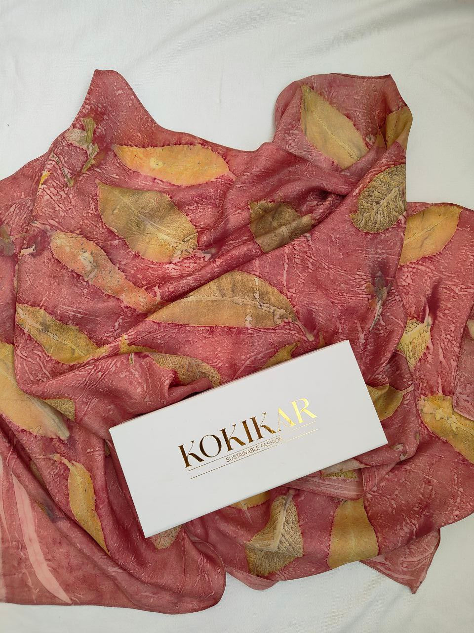 A pink scarf with Kokikar box