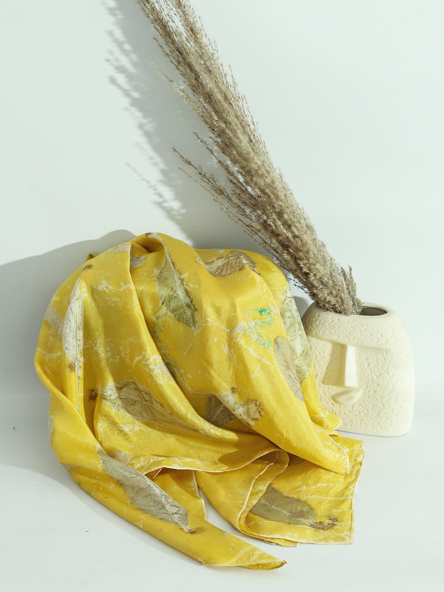A yellow square Silk scarf