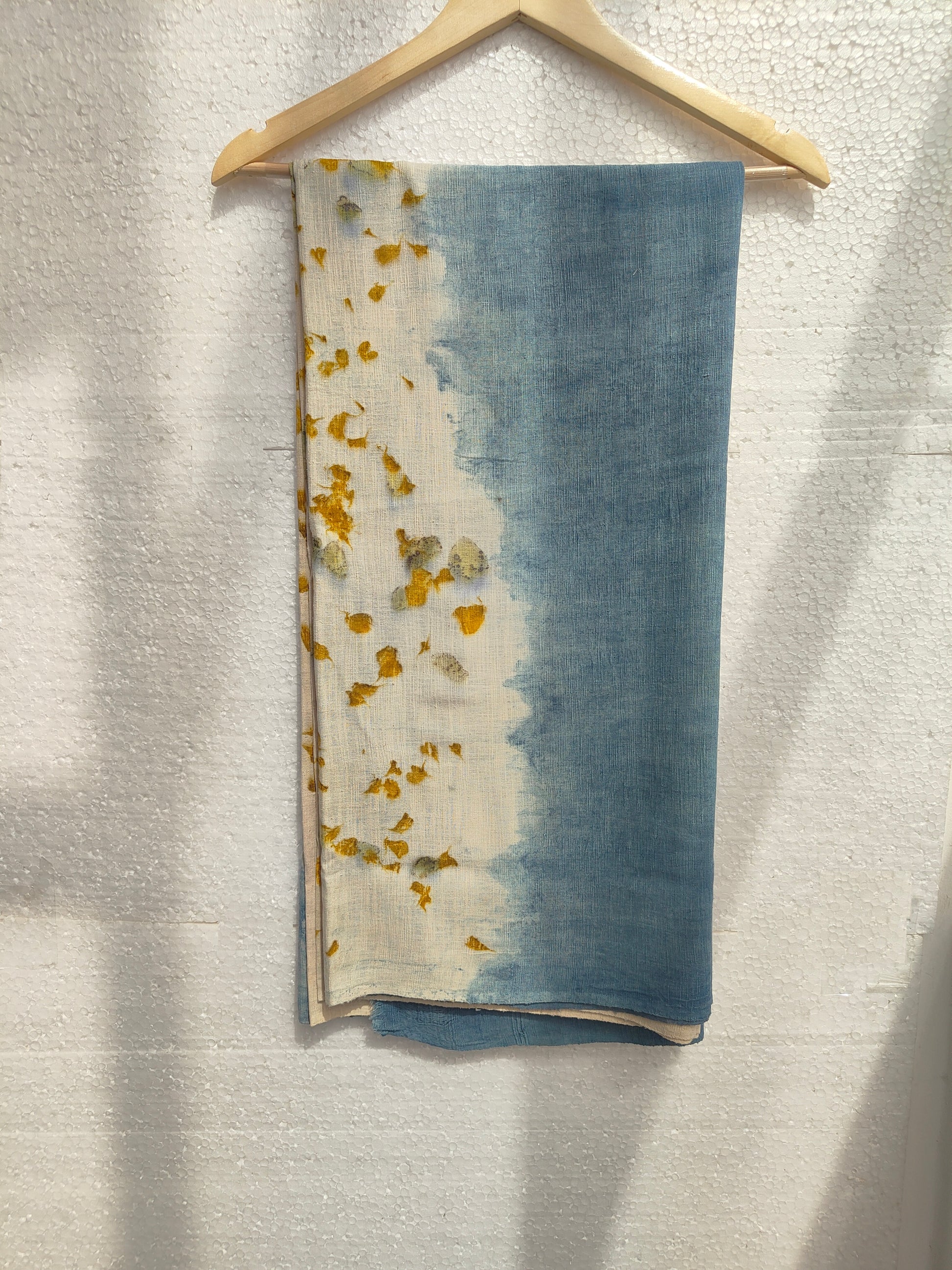 An ecoprinted eri silk scarf hanging