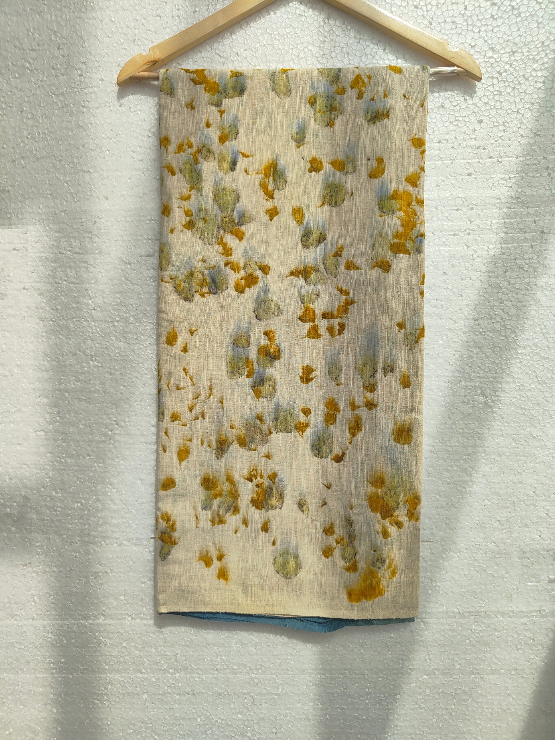 A marigold petal ecoprinted scarf
