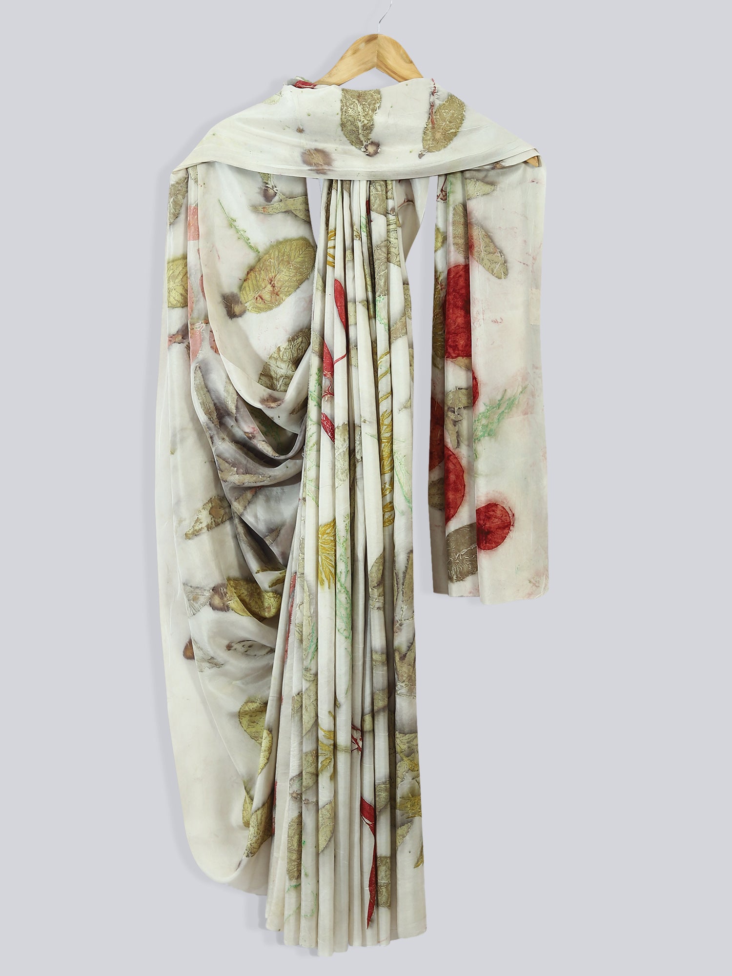 A white draped saree ecoprinted with jamun & guava leaves