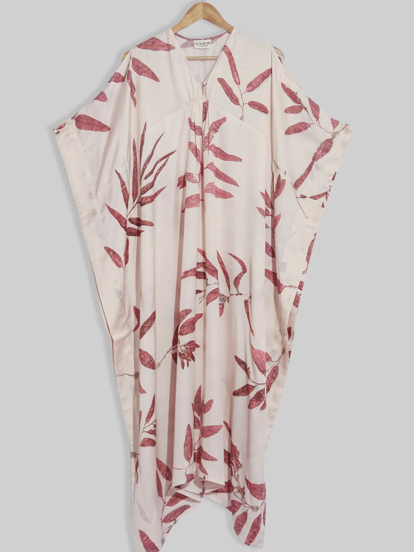 Red eucalyptus ecoprinted kaftan on kokikar wall