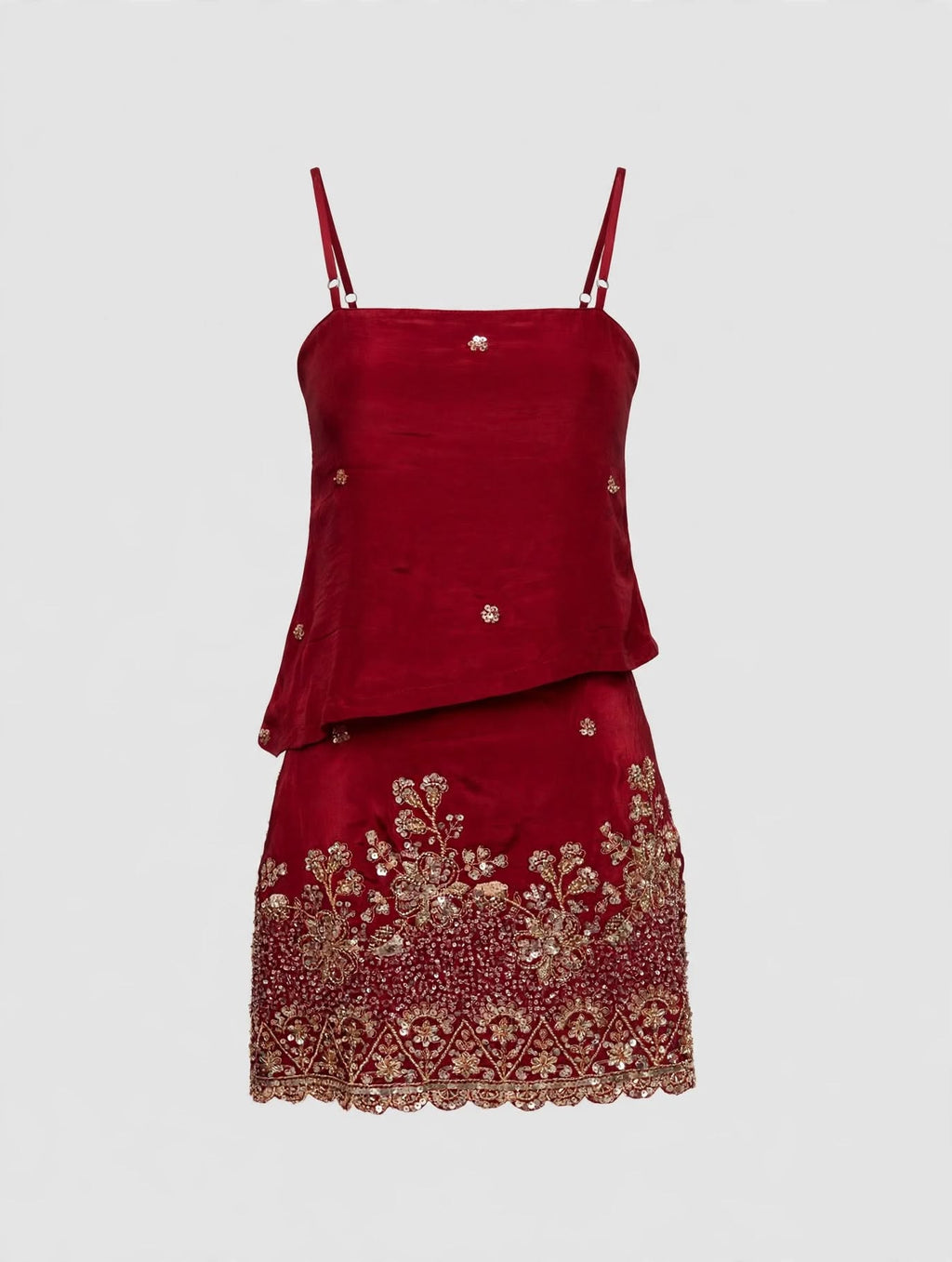 Deep red mini skirt and top with beads on a transparent mannequin