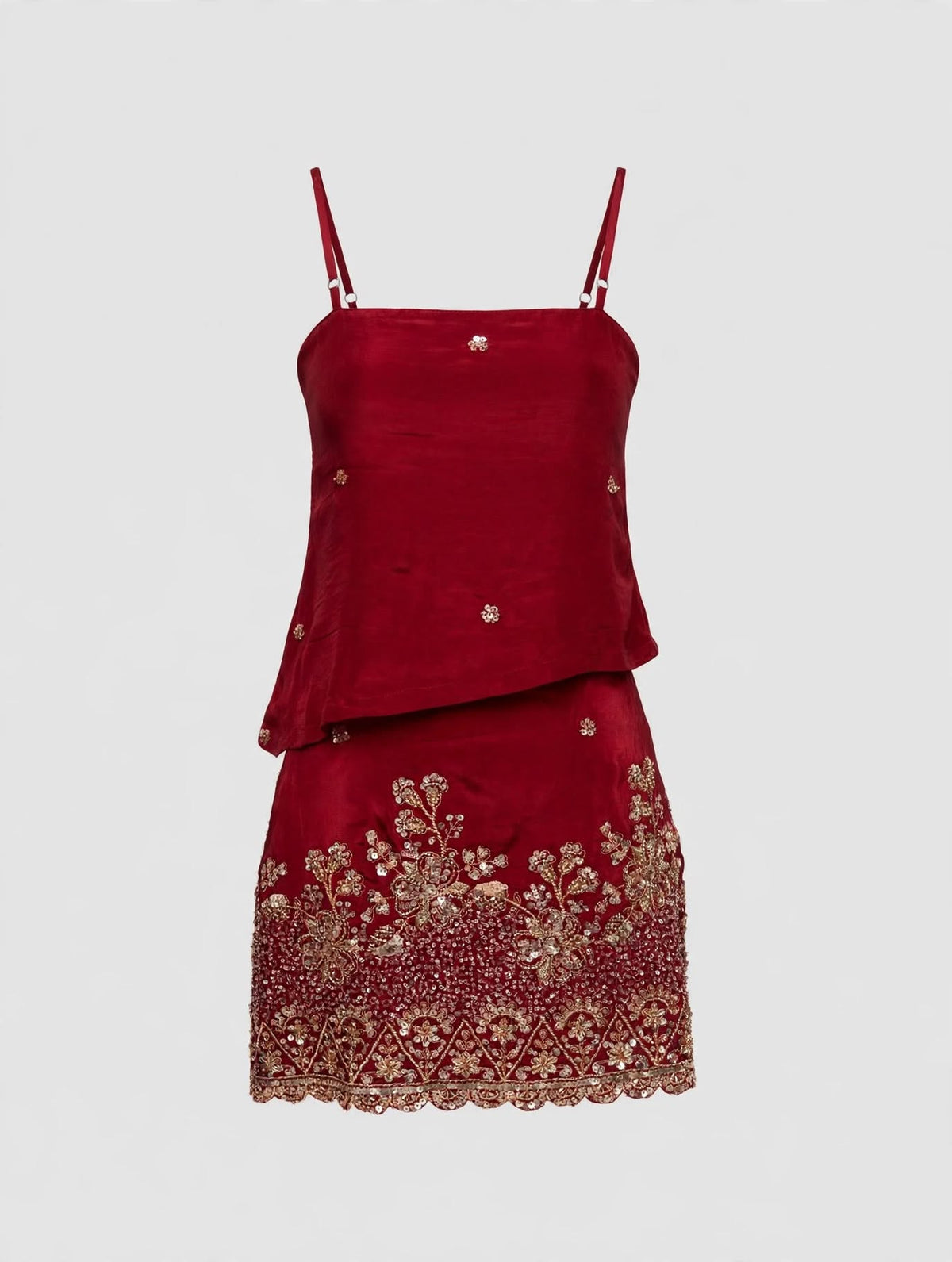 Deep red mini skirt and top with beads on a transparent mannequin