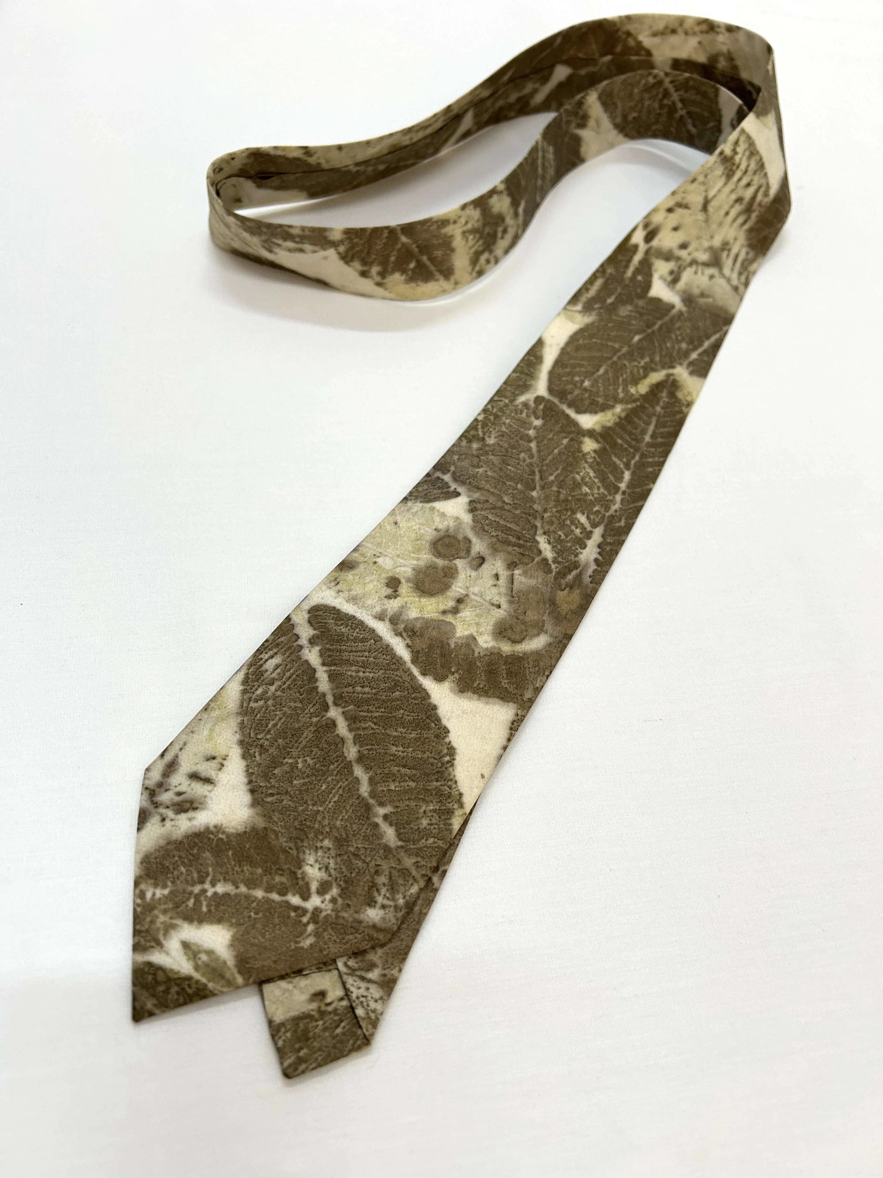 silk Tie with leaf pattern on a white background
