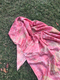 Handmade eco printed pure silk scarf with pink botanical leaf patterns created using natural dyes and sustainable eco printing techniques.