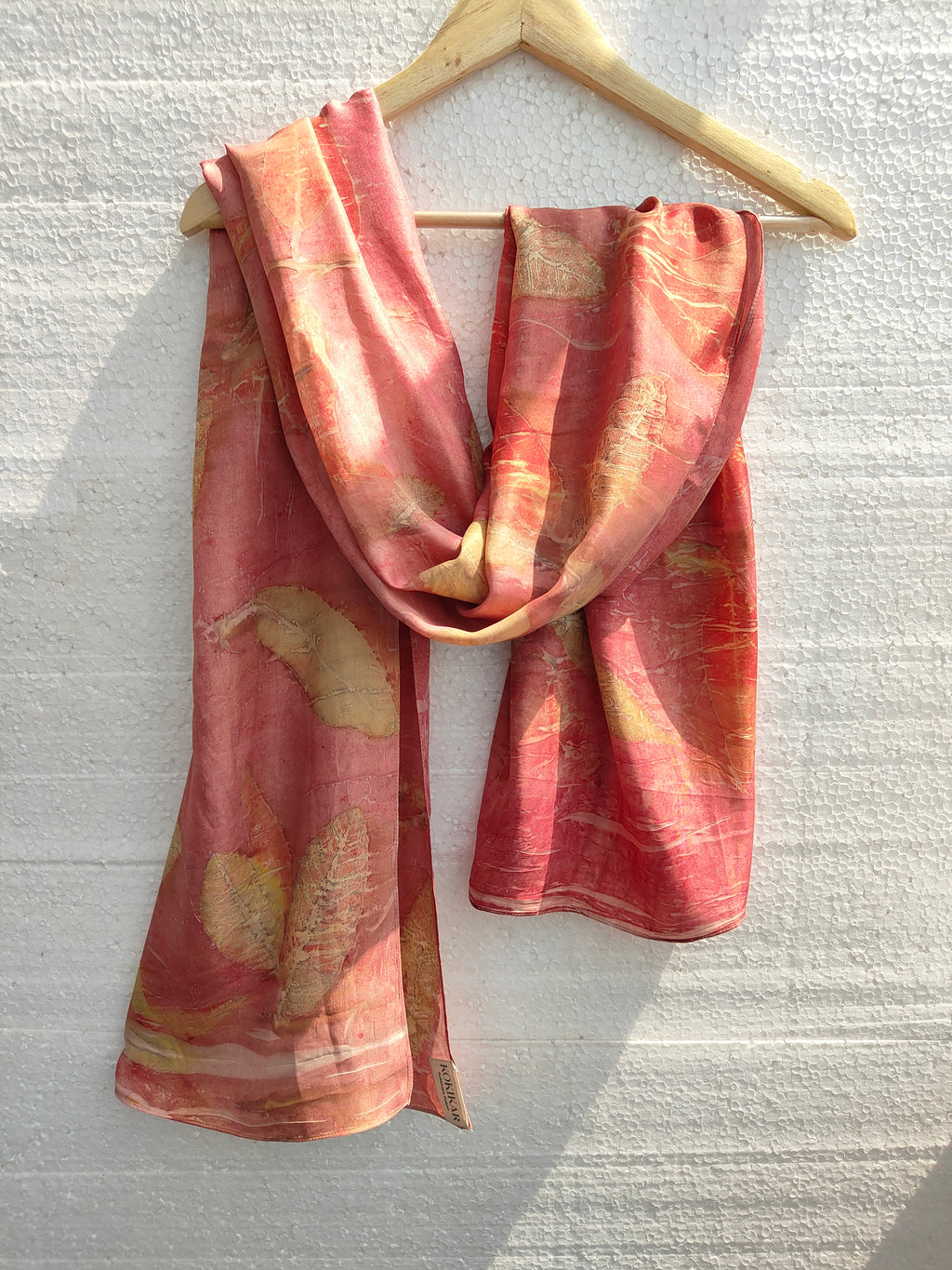 An eco printed pink silk scarf