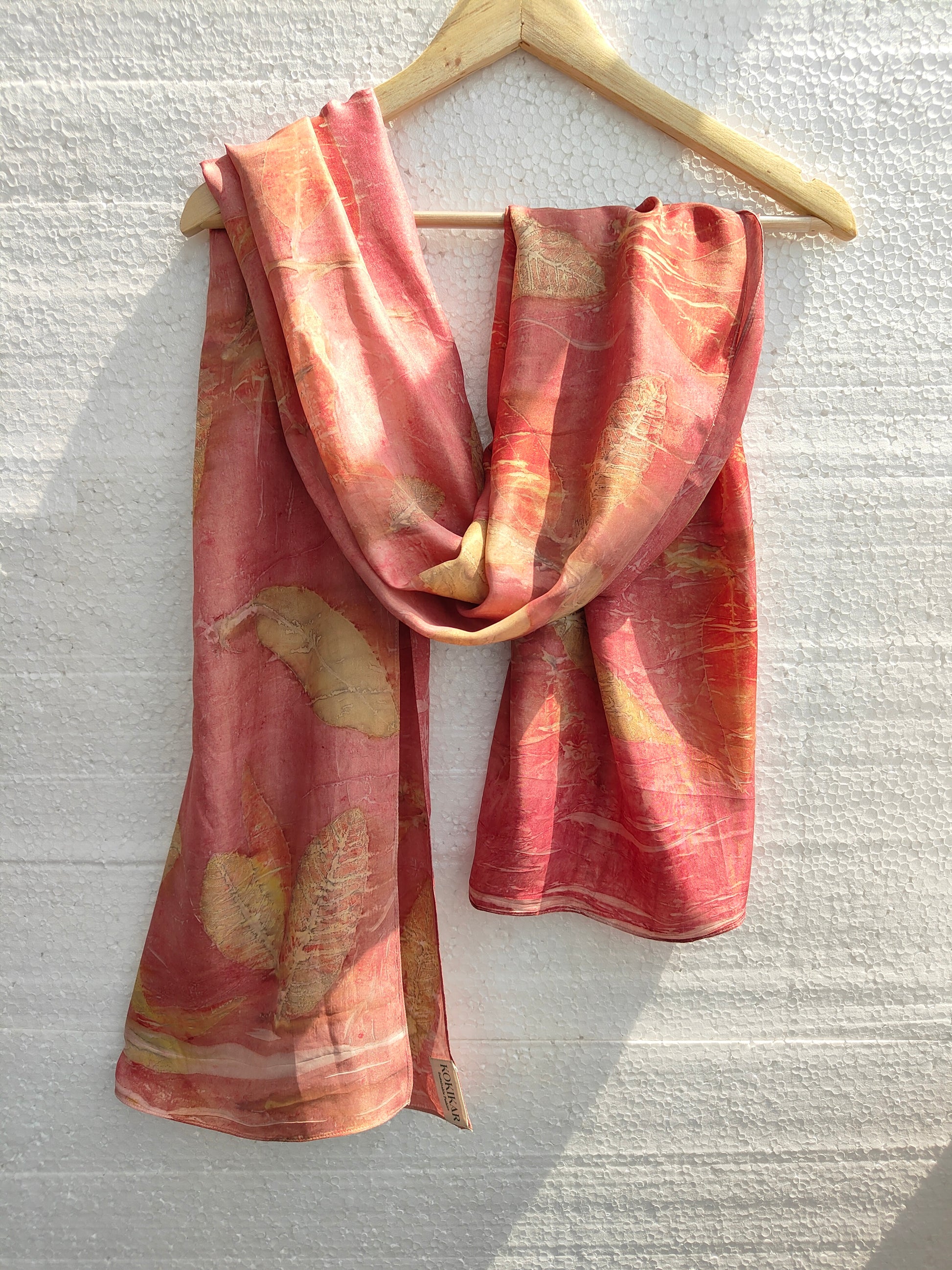 An eco printed pink silk scarf