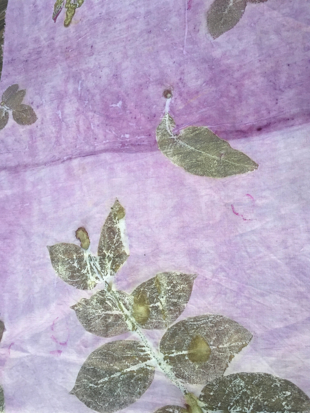 A linen fabric with ecoprinted jamun leaves