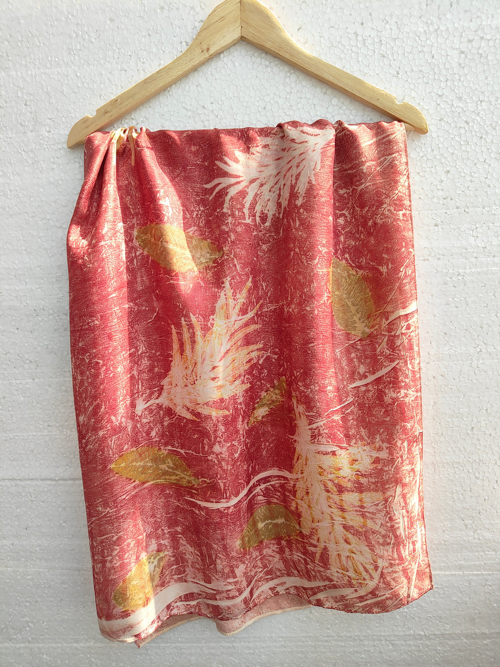 The ecoprinted shrubs and leaves on silk scarf